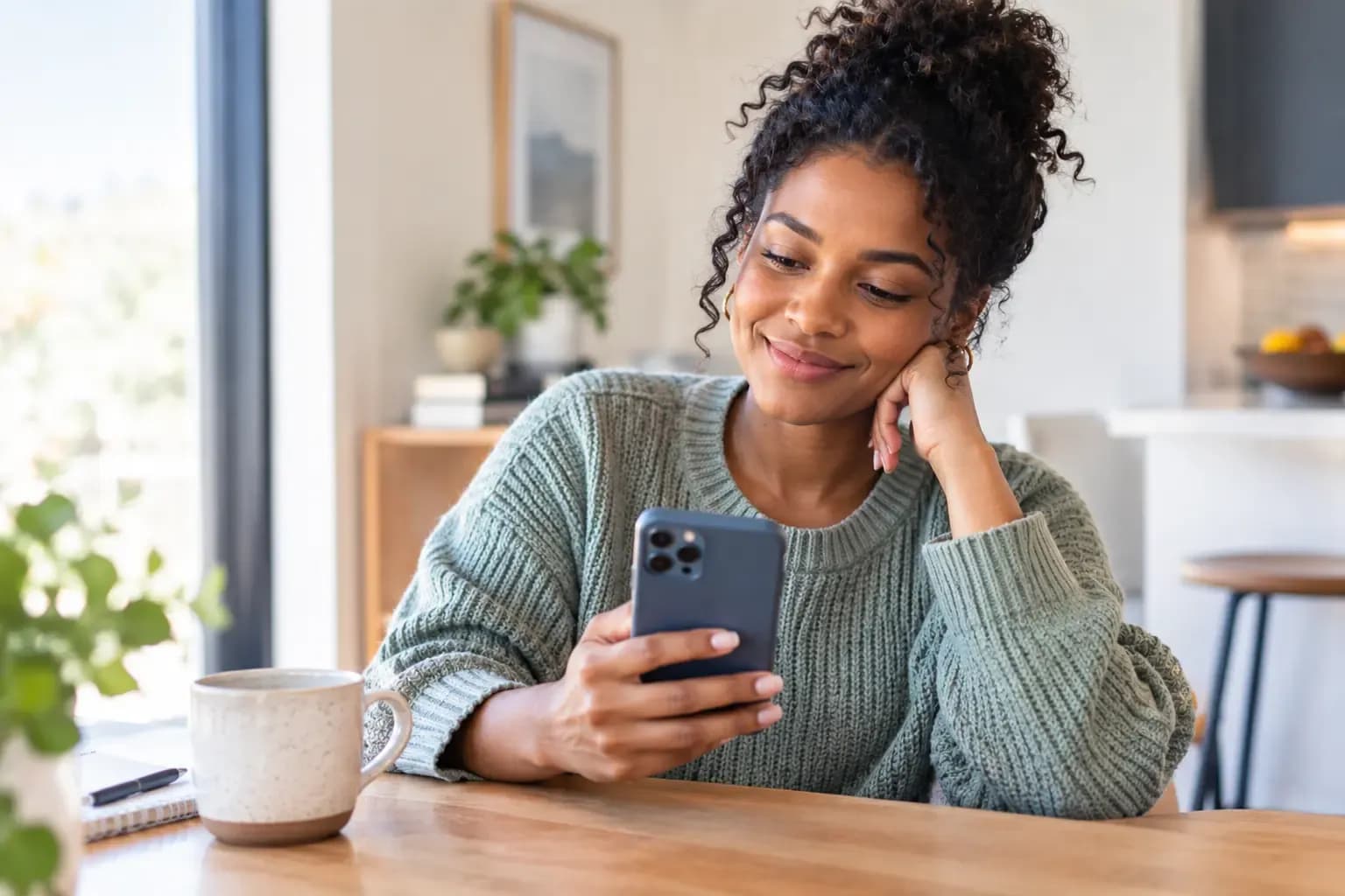 Woman browsing and comparing mobile phone plans on her smartphone